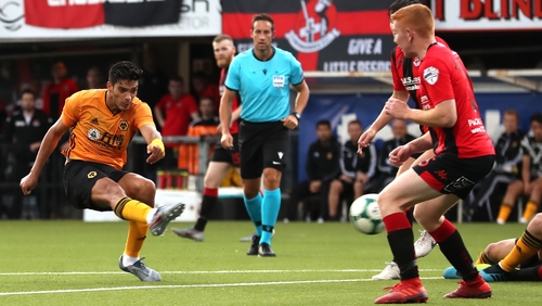 Raul Jimenez (L) scores Wolves' third goal