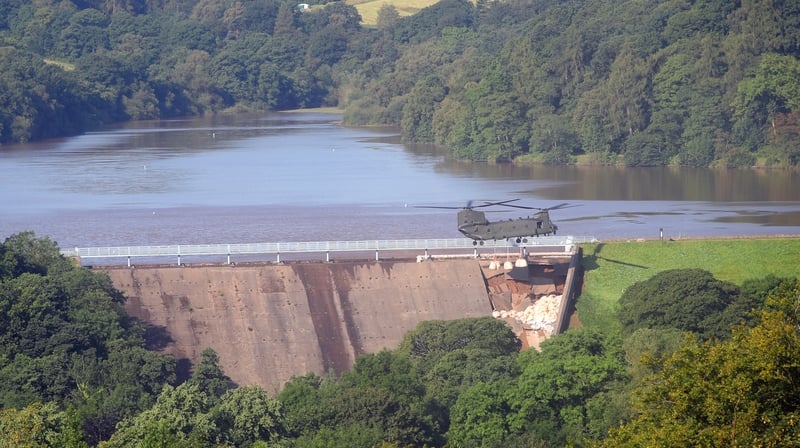 RAF Chinook was used to drop massive sandbags to bolster the structure