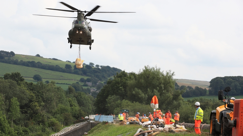 Army helicopters have been dropping sandbags onto the dam