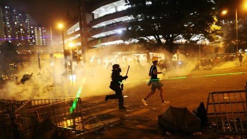 Anti-extradition protesters clash with police in the Wong Tai Shin district of Hong Kong