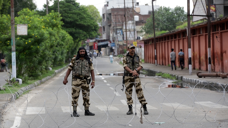 Indian soldiers stand guard in Kashmir to deter protests over scrapping the regions special status