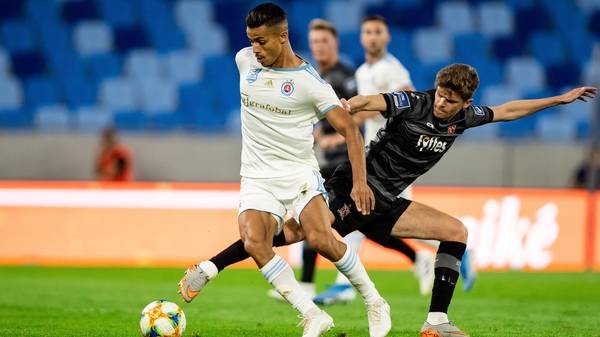 Mohammed Rharsalla of Slovan Bratislava battles with Sean Gannon