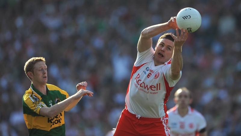 Conor Gormley gets to the ball ahead of Colm Cooper in the 2008 All-Ireland final