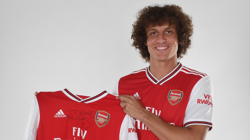 David Luiz poses in his Arsenal shirt