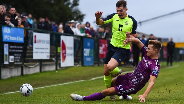 Charlie Fleming of Cobh is tackled by Daniel Cleary