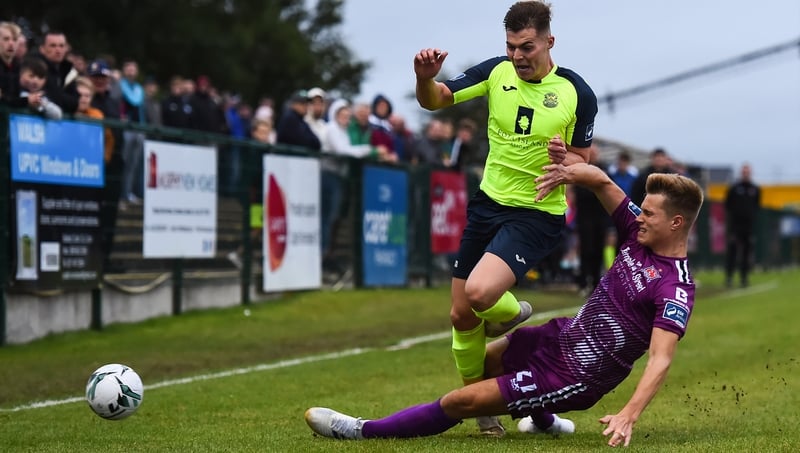 Charlie Fleming of Cobh is tackled by Daniel Cleary