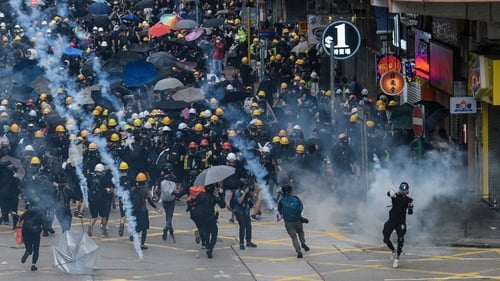 Seeking to clear streets quicker than before, police fired tear gas and charged with batons at flash points