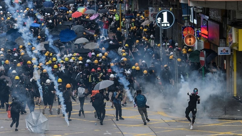 Seeking to clear streets quicker than before, police fired tear gas and charged with batons at flash points