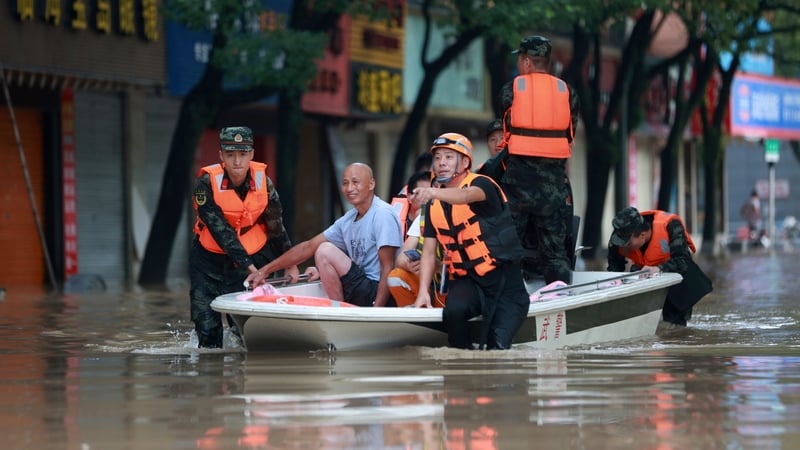 Footage showed fields and streets flooded by muddy water, submerged vehicles and trees blown over