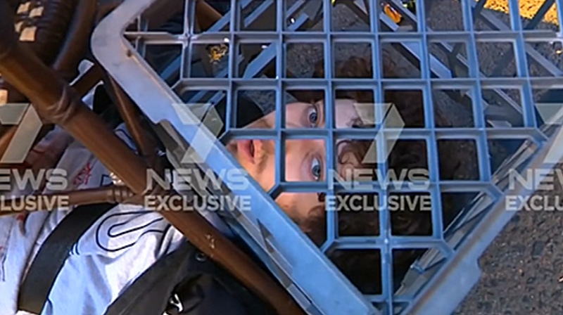 Members of the public used a milk crate to hold the man down