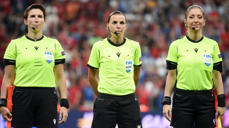 Referee Stephanie Frappart (C) looks on with assistant referees, Manuela Nicolosi (R) and Michelle O'Neill