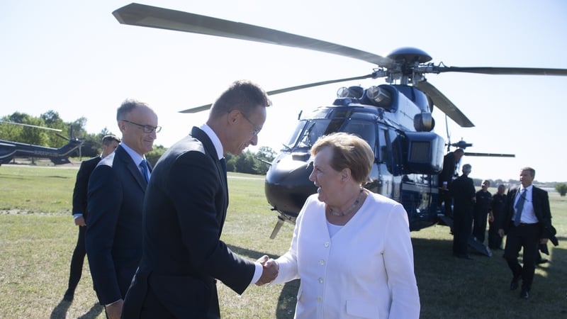 Hungarian Minister of Foreign Affairs and Trade Peter Szijjarto welcomes Angela Merkel to Sopron