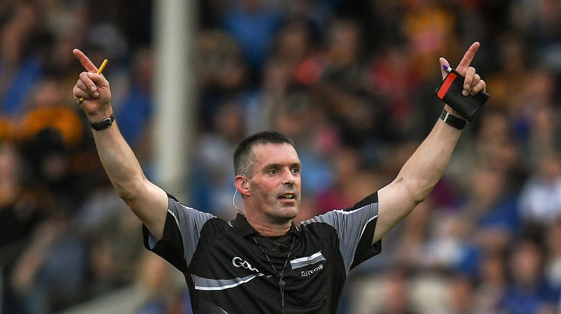 Referee James Owens calls for a Hawk-Eye intervention