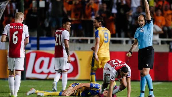 Noussair Mazraoui of Ajax, receives a red card from referee Antonio Mateu Lahoz