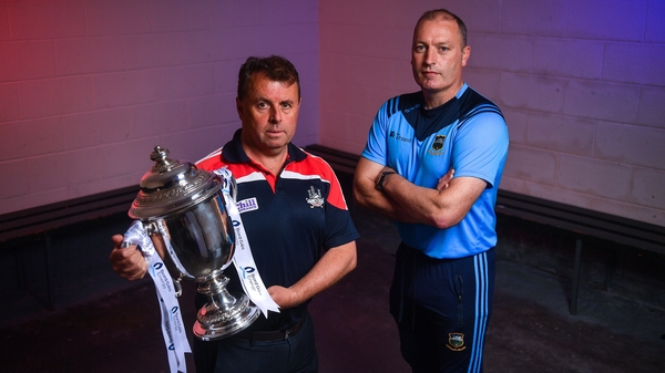Cork manager Denis Ring (l) and and Tipperary boss Liam Cahill with the cup