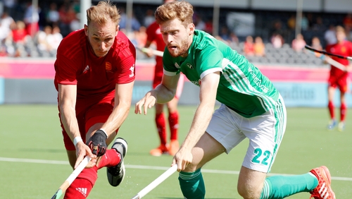 Ireland's goal scorer Michael Robson, right, in action against England