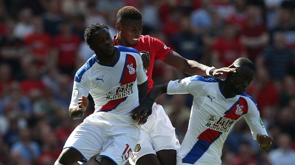 Paul Pogba rises with Jeffrey Schlupp and Cheikhou Kouyate