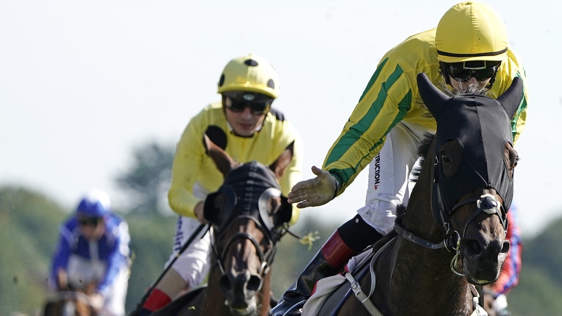 Colin Keane in the yellow and green steers Mustajeer to victory