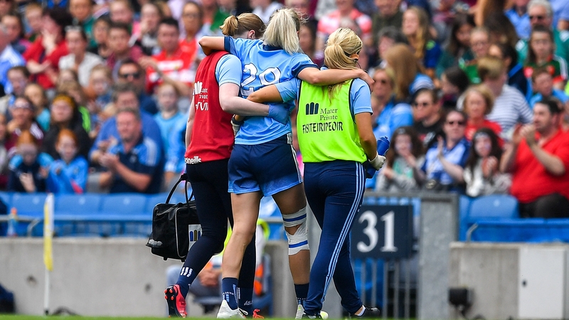 Nicole Owens is helped from the pitch