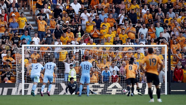 Raul Jimenez scores from the penalty spot
