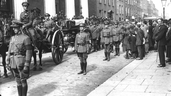 The coffin of Michael Collins on a horse drawn gun carriage, outside the Pro-Cathedral Dublin, on 2…