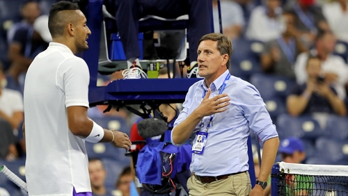 Nick Kyrgios discusses a ruling with tournament official Remy Azemar
