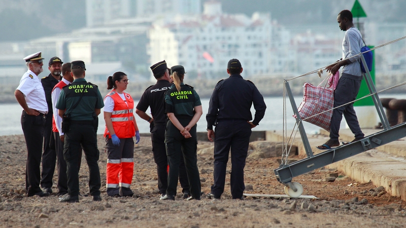 People disembark navy vessel Audaz at San Roque, Spain
