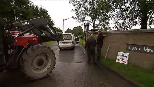 A protester drove his tractor towards a wall at a plant in Cavan
