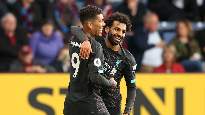 Roberto Firmino celebrates a goal with Mohamed Salah
