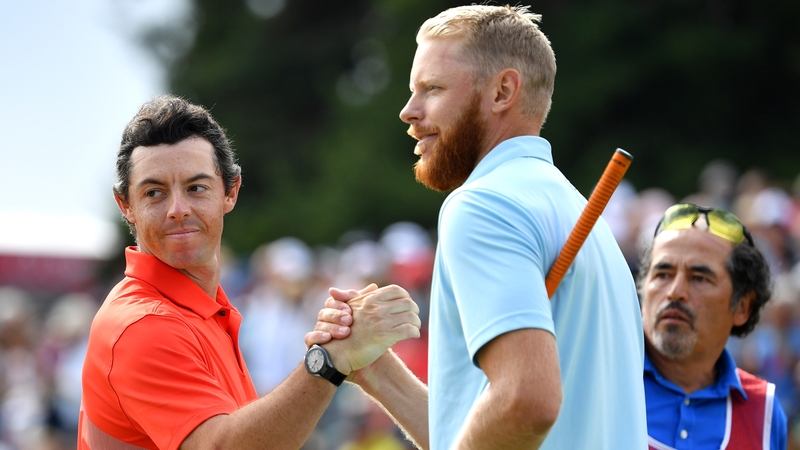 Rory McIlroy congratulates the champion Sebastian Soderberg following the play-off win