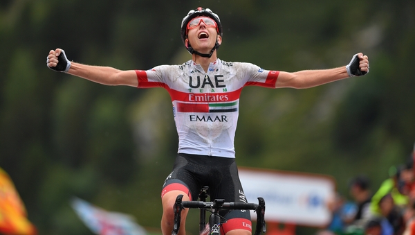 Tadej Pogacar celebrates victory in the mountains on stage 9
