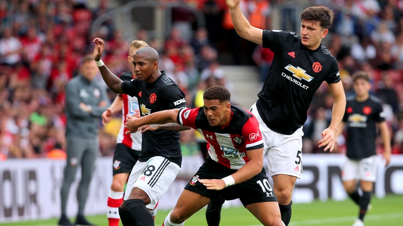 Southampton's Che Adams (centre) clashes with Manchester United's Ashley Young (left) and Harry Maguire