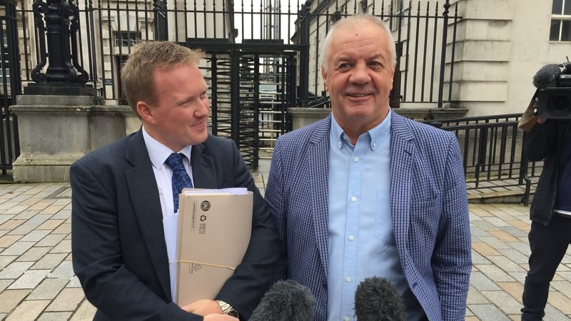 Raymond McCord (right) pictured outside Belfast High Court