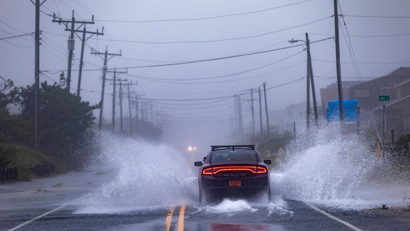 A police car drives down a flooded road as Hurricane Dorian hits Kill Devil Hills in North Carolina