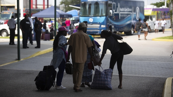 The evacuees arrived at the Port of Palm Beach after an all-night voyage on the Grand Celebration