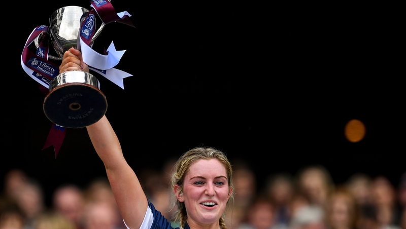 Mairead McCormack raises the trophy