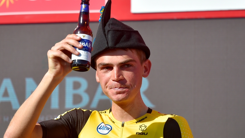 Team Jumbo rider US Sepp Kuss sinks a beer to celebrate his stage win