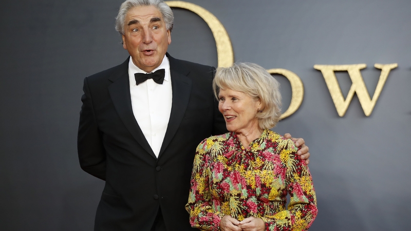 Jim Carter and Imelda Staunton pose on the red carpet upon arrival for the world premiere of the film Downton Abbey