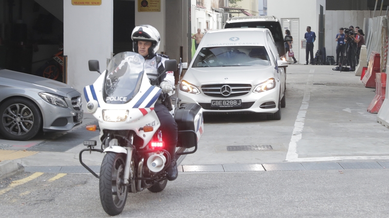 A hearse transporting Mugabe's body left a Singapore funeral home accompanied by a police escort