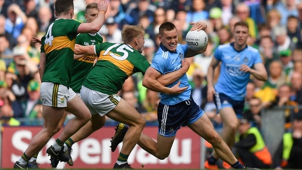 Con O'Callaghan of Dublin is tackled by Killian Spillane