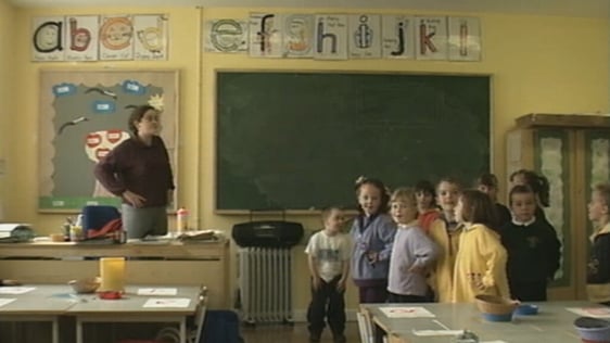 Gaelscoil Chnoc na Ré Principal Gina Nío Lionsigh in classroom with children (1999)