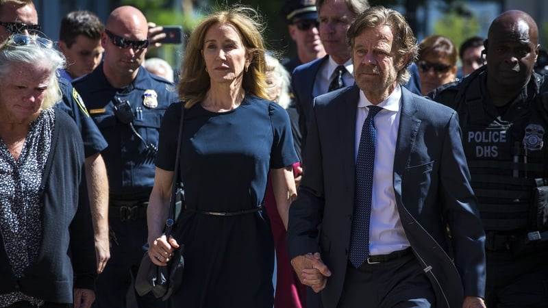 Felicity Huffman with husband William H Macy pictured at the courthouse before sentencing