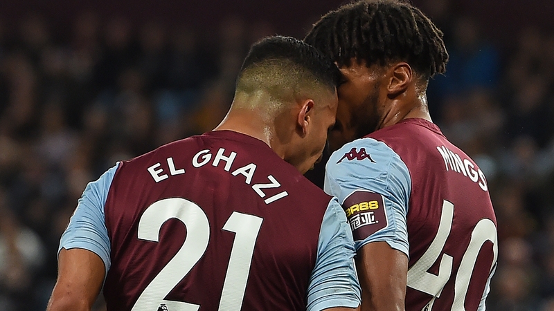 Aston Villa's Dutch striker Anwar El Ghazi (L) goes head to head with Tyrone Mings