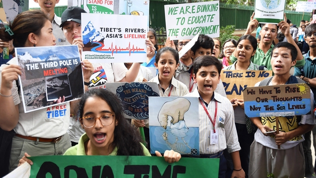 Indian activists and students gather for a protest against climate change in New Delhi