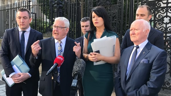 Francis McGuigan (2nd L) and Liam Shannon (R) expect the PSNI to appeal the decision to the Supreme Court in London