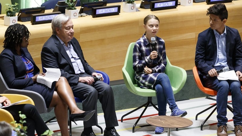 Greta Thunberg speaks as UN Secretary-General Antonio Guterres (L) and climate activist Bruno Rodriguez (R) listen at the start of the UN Youth Climate Summit