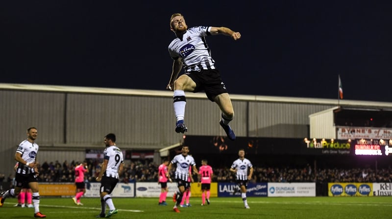 Seán Hoare soars high as he celebrates scoring the opener at Oriel Park