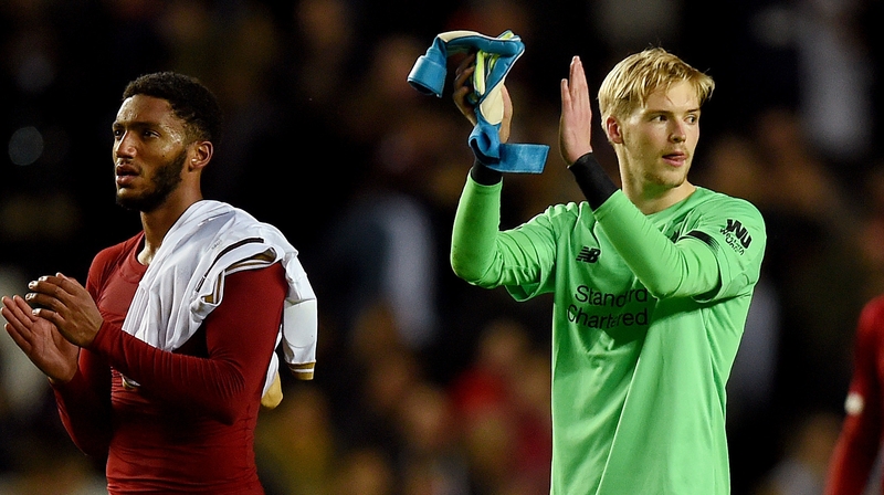Caoimhin Kelleher (R) applauds the fans after Liverpool's win