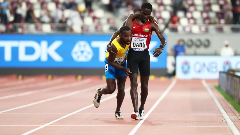 Braima Dabo supports a cramping Jonathan Busby in Doha