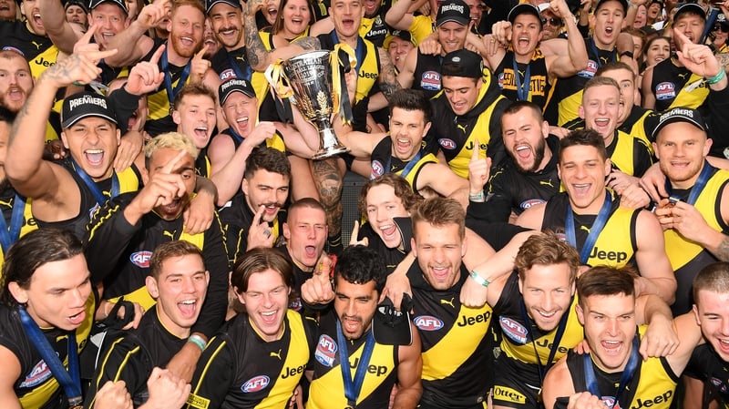 The Tigers celebrate with the Premiership Trophy